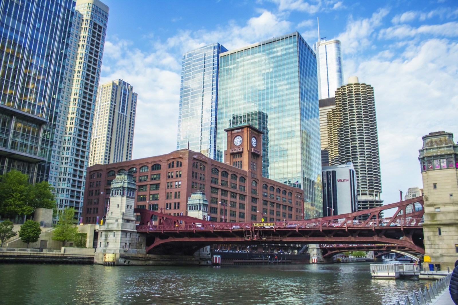 A steel bridge and brick buildings along the Chicago River